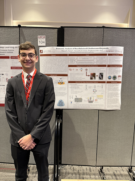 Student in front of poster